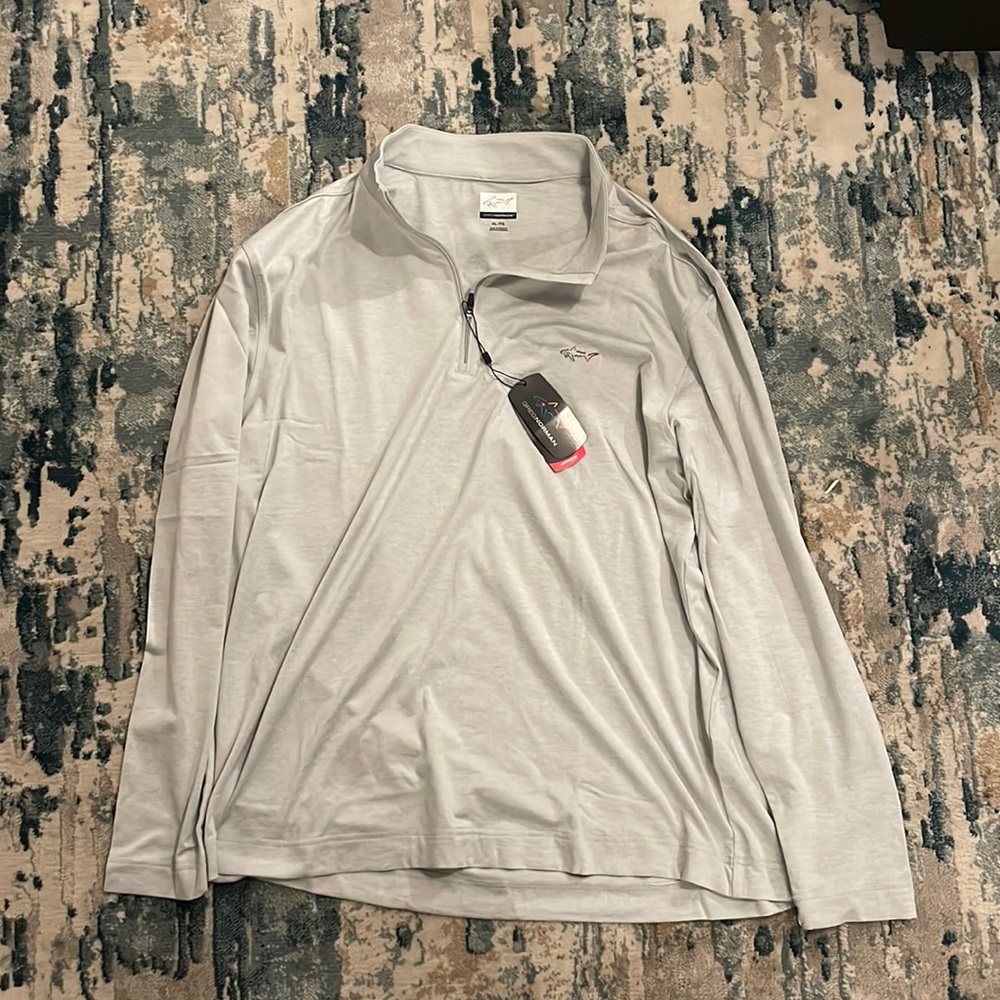 Greg Norman quarter zip performance material.